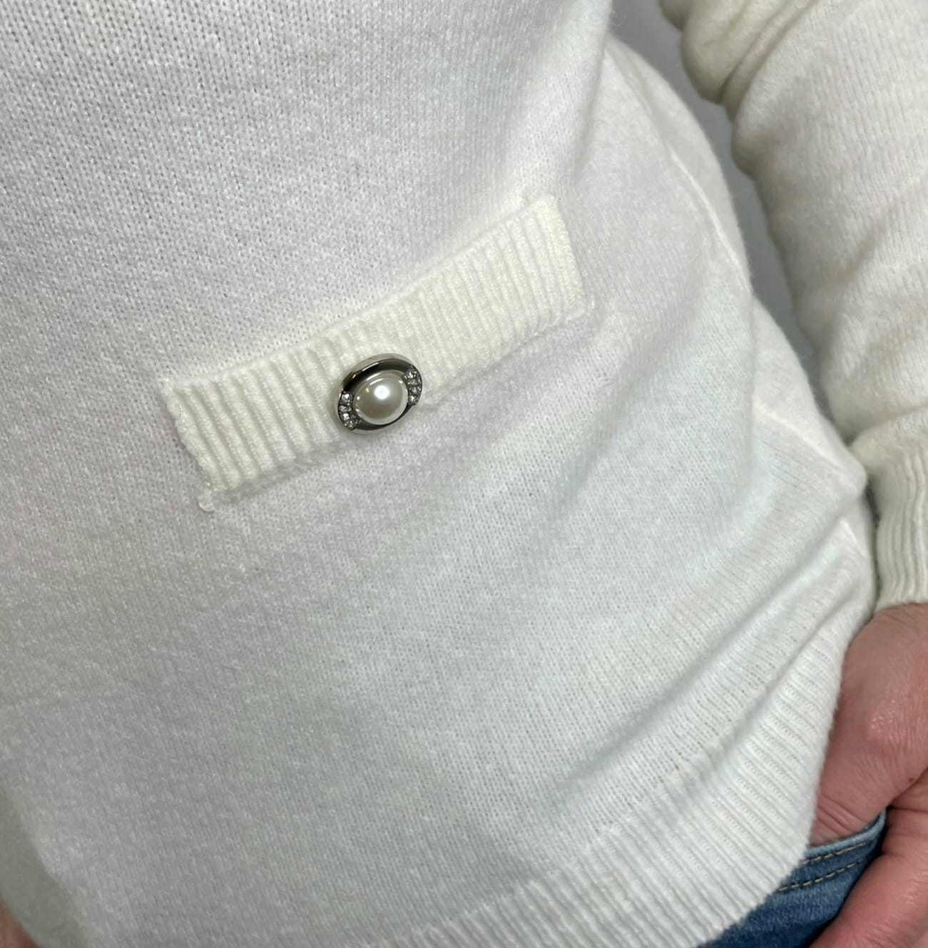 Pearl button jumper pocket detail