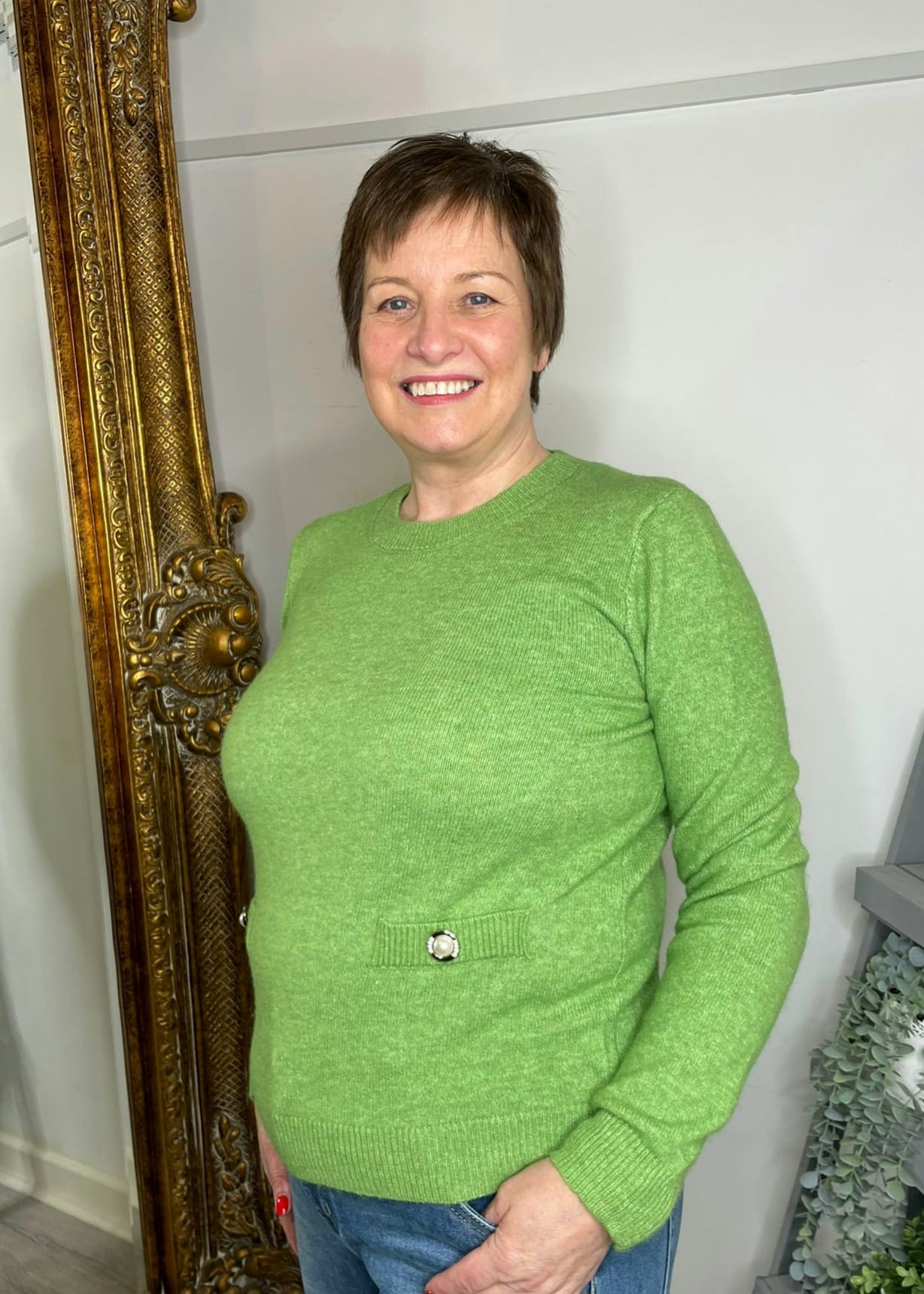 Green pearl button jumper front